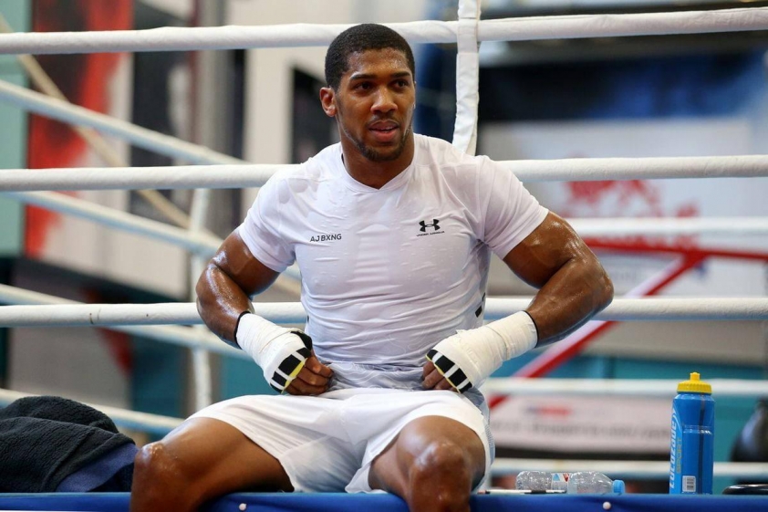 anthony-joshua-posing-in-a-white-shirt-7r3v3vcbz74q7ztm-68382d0661b74