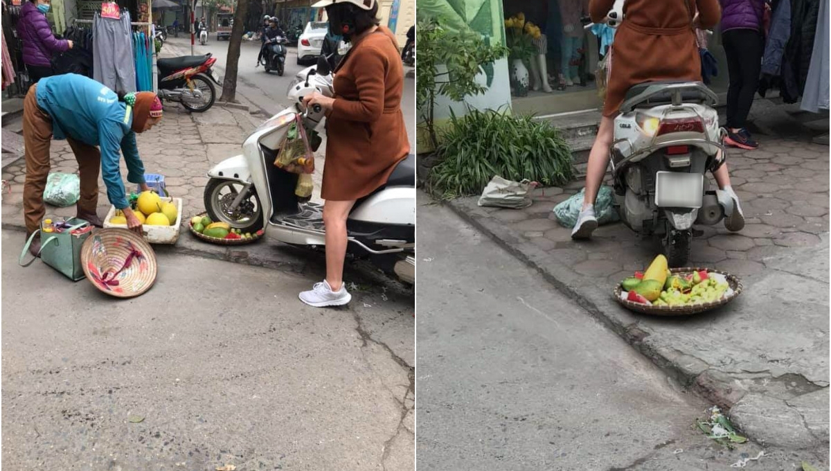 Người phụ nữ đi Honda Lead cán nát mẹt hoa quả của bà lão bán rong